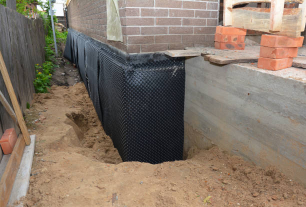Happy homeowners after waterproofing job in Mount Saint Joseph